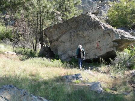 Dr. Kathie Hendry examining some native pictographs